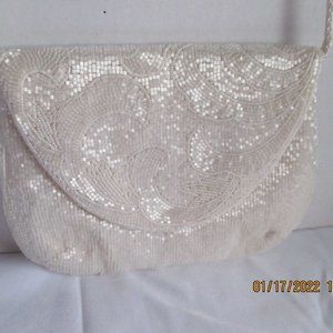 White beaded/sequin  purse.  Silk lined.